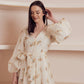 Light cream midi dress with balloon sleeves and delicate umbrella print.