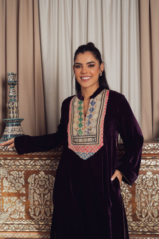 A luxurious deep purple velvet kaftan