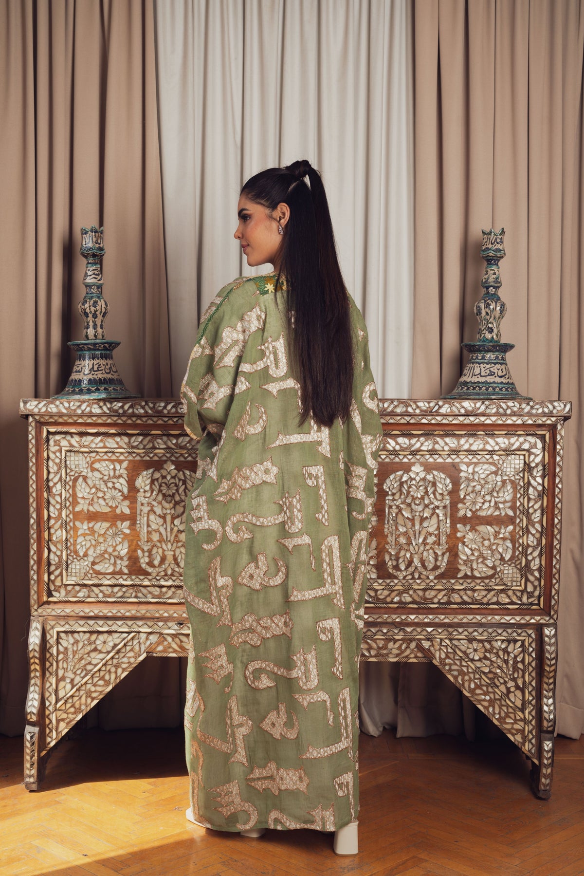 A chic olive green open-front kaftan